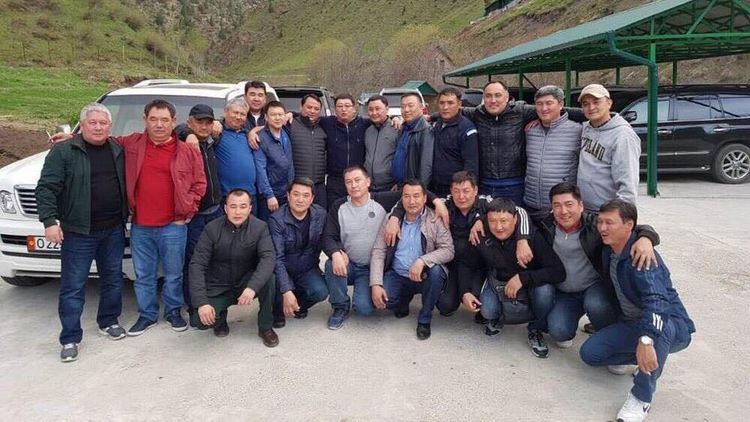 A group of men pose together for a photo qzeiqrqiqqdidezglv